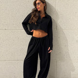 חליפת פולו שרוול ארוך שחורה